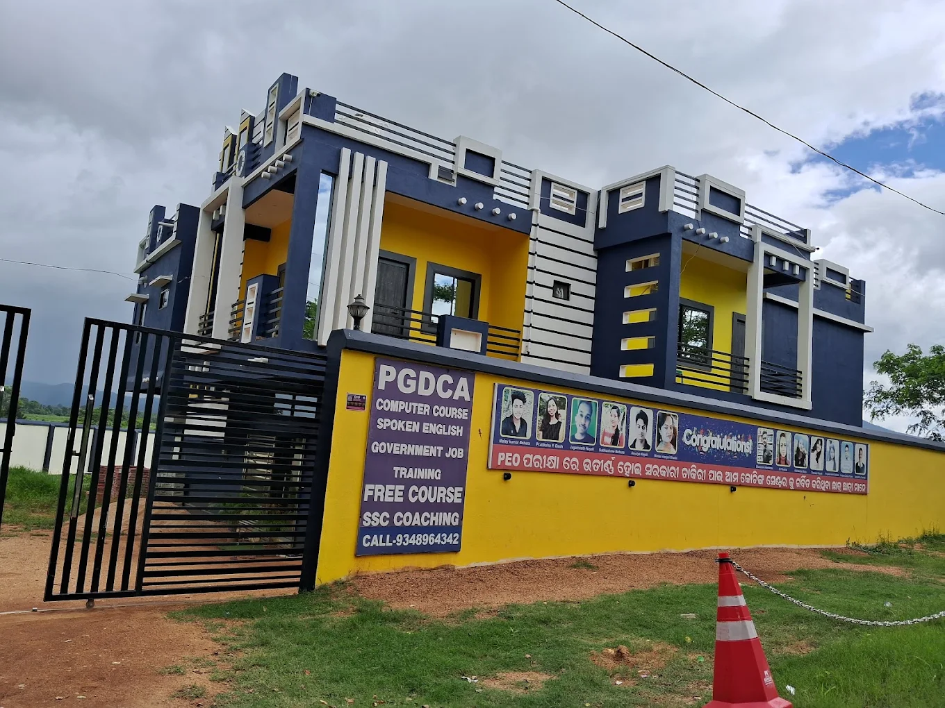 The Career Booster coaching centre building in Keonjhar, with the selection board along the boundary wall